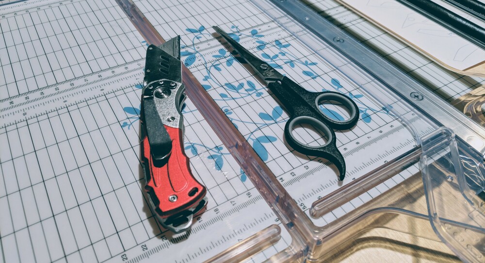 paper cutter, razor, and scissors